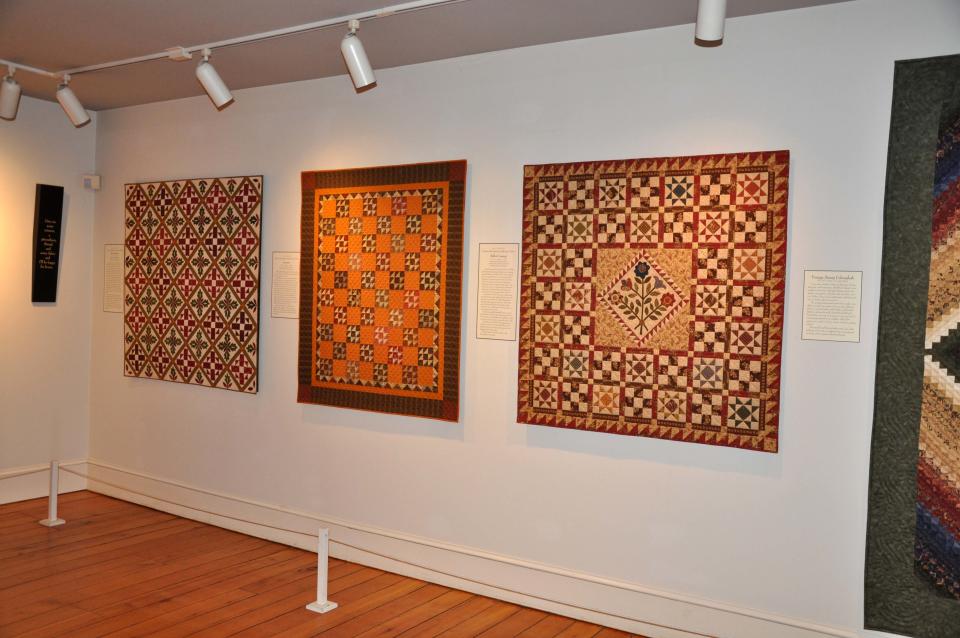 This 2012 photo released by The Quilt Museum at The Old Country Store shows quilts displayed as part of the "Favorite Reproduction Quilts by Jo Morton," at The Quilt Museum at The Old Country Store in Intercourse, Pa. The harvest season is nearing its glorious end, and the culture, architecture and history of Pennsylvania's Amish country can be seen for free in Lancaster County, where many Amish settled, starting in the early 1700s. (AP Photo/The Quilt Museum at The Old Country Store)