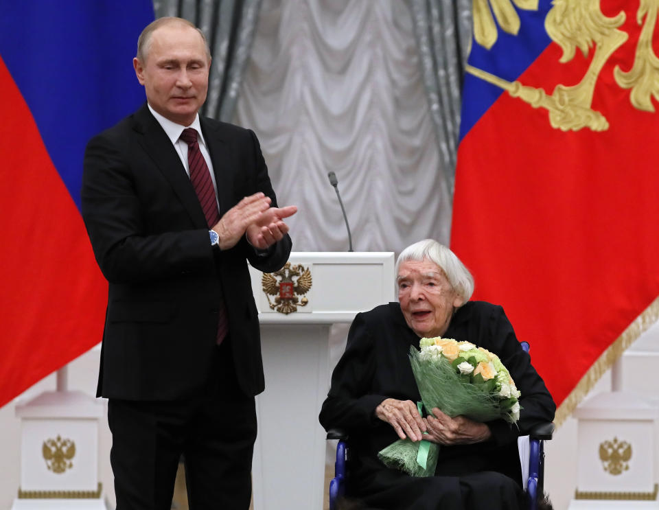 FILE In this file photo taken on Monday, Dec. 18, 2017, Russian President Vladimir Putin, left, congratulates the Moscow Helsinki Group Chair and human rights activist Lyudmila Alexeyeva, during a ceremony to present the 2017 State Awards for Outstanding Achievements in Human Rights and and Charity Work in the Kremlin in Moscow, Russia . Alexeyeva, who was forced into exile by Soviet authorities after founding Russia's oldest human rights organization in 1976, passed away in a Moscow hospital Friday, Dec. 7, 2018 at age 91. (Yuri Kochetkov/Pool Photo via AP, File)