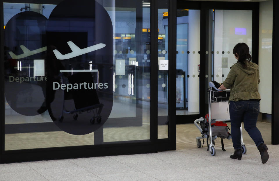 A passenger enters departures in Terminal 2 at Heathrow Airport in London. Photo: Luke MacGregor/Reuters