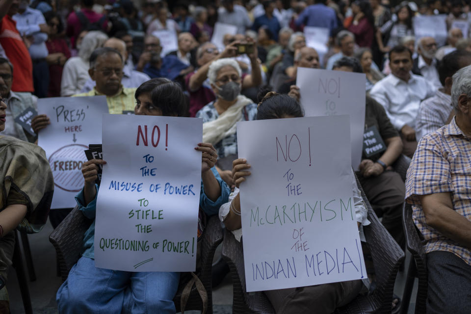 Indian journalists hold placards during a protest at press club of India in New Delhi, India, Wednesday, Oct., 4, 2023. Police in New Delhi on Tuesday arrested the editor of a news website and one of its administrators after raiding the homes of journalists working for the site, which has been critical of Prime Minister Narendra Modi and his Hindu nationalist-led government. (AP Photo/Altaf Qadri)