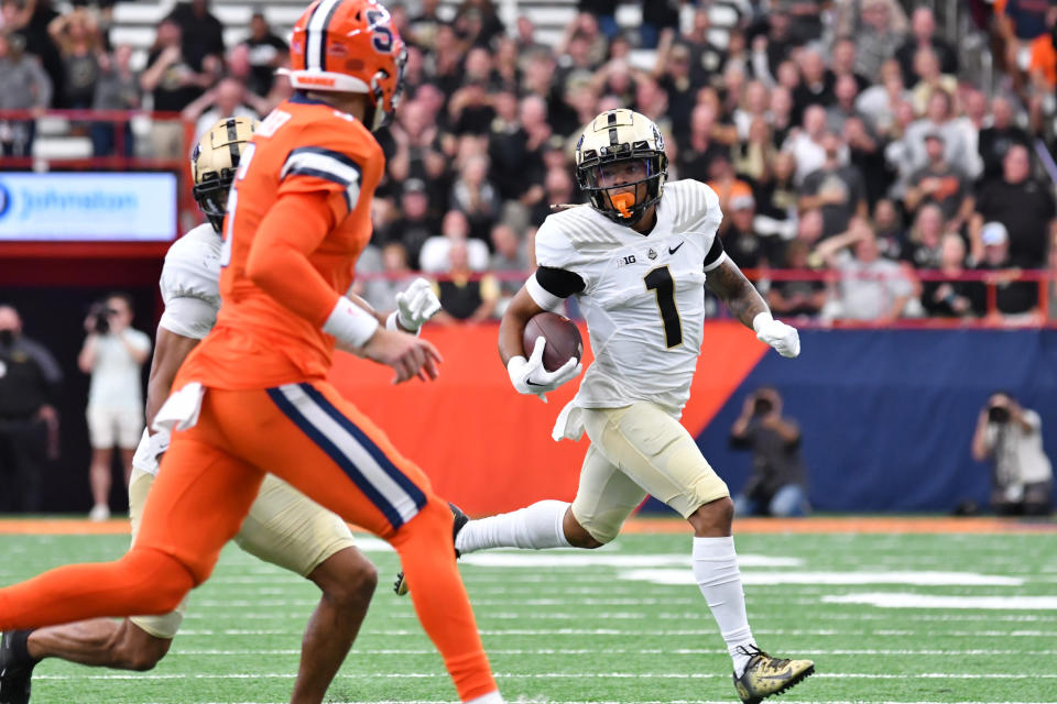 Sep 17, 2022; Syracuse, New York, USA; Purdue Boilermakers defensive back Reese Taylor (1) returns an interception in the second quarter against the Syracuse Orange at JMA Wireless Dome. Mandatory Credit: Mark Konezny-USA TODAY Sports