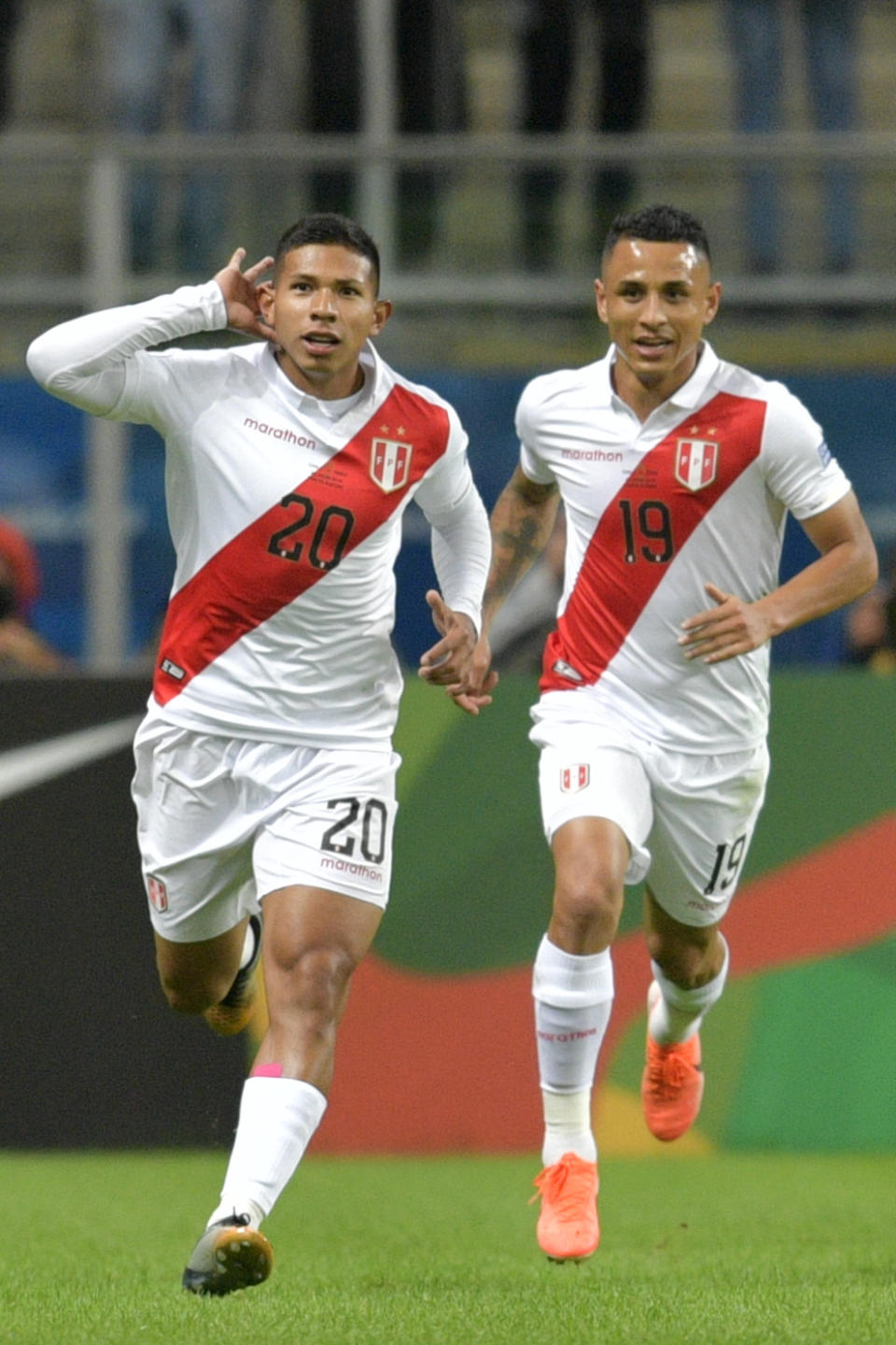 Peru's Edison Flores (L) celebrates with teammate Yoshimar Yotun after scoring against Chile during their Copa America football tournament semi-final match at the Gremio Arena in Porto Alegre, Brazil, on July 3, 2019. (Photo by Raul ARBOLEDA / AFP)        (Photo credit should read RAUL ARBOLEDA/AFP/Getty Images)