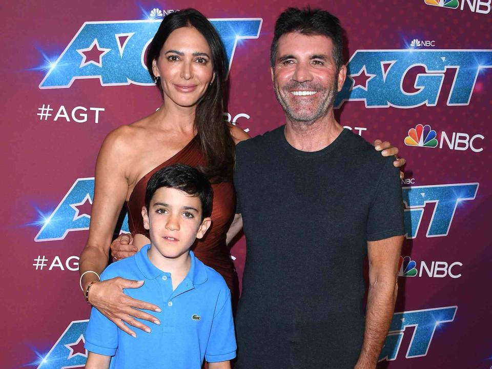 <p>Steve Granitz/WireImage</p> Lauren Silverman, Eric Cowell and Simon Cowell arrives at the Red Carpet For "America