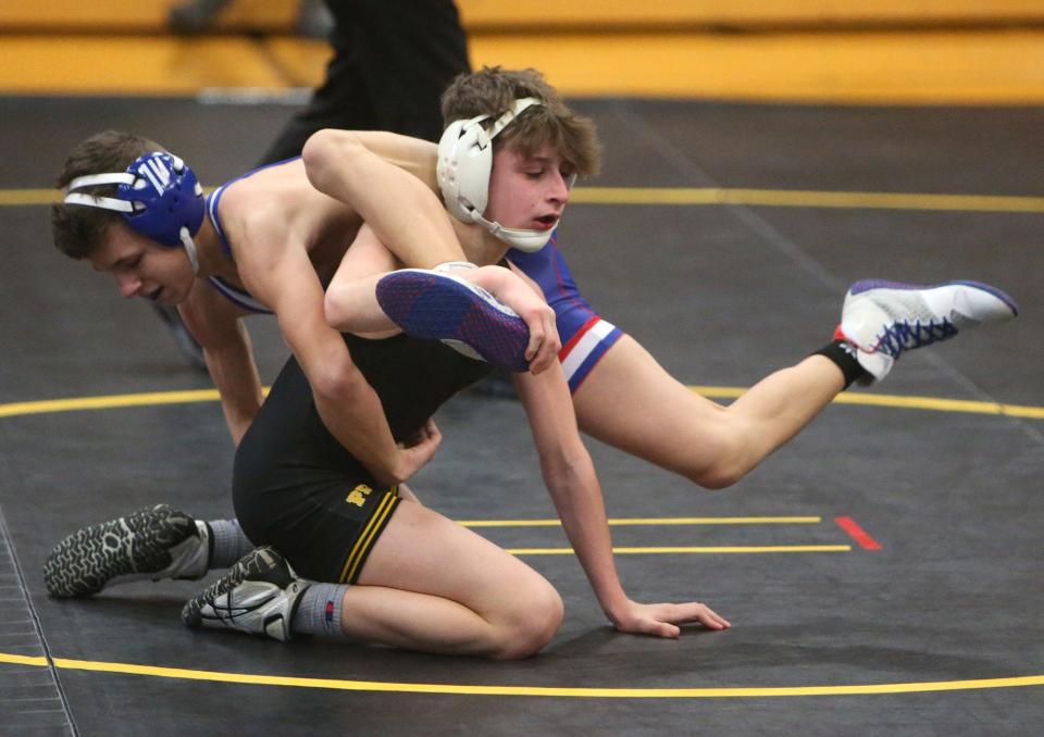 Emeric McBurney, right, of Perry defeated Greyson Clemens, left, of Lake in a 106-pound bout at Perry on Thursday, Jan. 20, 2022.