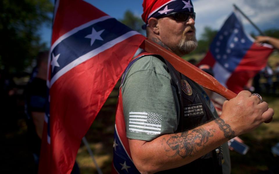  An activist with a Confederate flag gathers at the Gettysburg National Military Park on July 1, 2017 - Mark Makela/Getty Images
