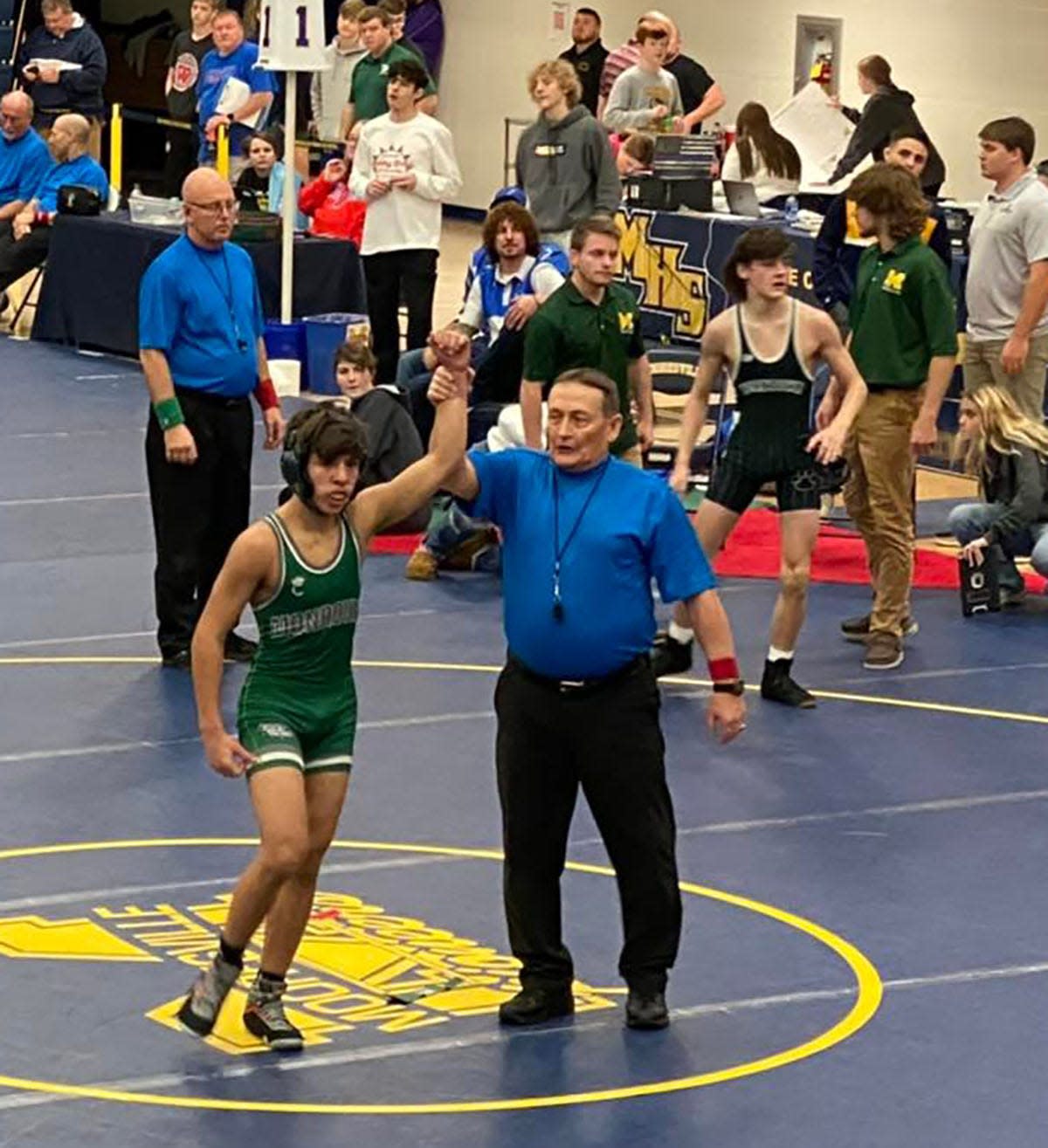 Monrovia freshman Isaac Ash is declared the winner in the 113-pound weight class at the Mooresville Holiday Classic on Wednesday, Dec. 29, 2021.