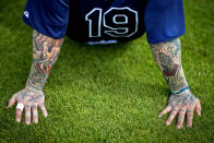 <p>Tattoos decorate the arms of Tampa Bay Rays’ Ryan Roberts as he takes a rest during a spring training baseball workout, Feb. 21, 2013, Port Charlotte, Fla. (AP Photo/David Goldman) </p>