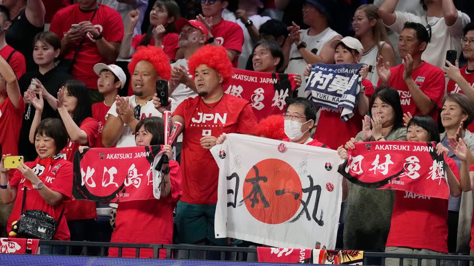 Japan's supporters celebrate after the team beat Finland in Okinawa on August 27, 2023.  - Hiro Komae/AP