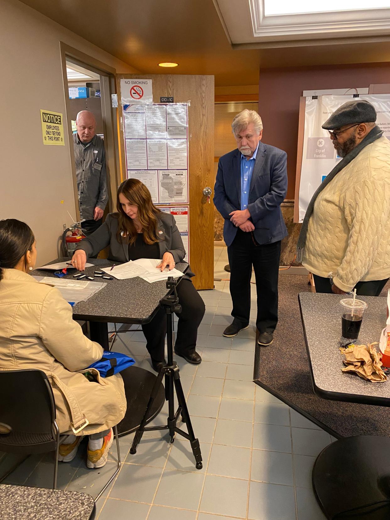Milwaukee Election Commission personnel delivered thumb drives with absentee ballot results to the county election commission office shortly before 10 p.m. Tuesday.