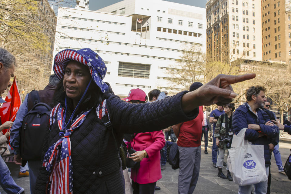 A supporter for former President Donald Trump, who only identified herself as Sophia, demonstrates outside Manhattan criminal court, Monday, April 15, 2024, in New York. The hush money trial of Trump begins Monday with jury selection. It's a singular moment for American history as the first criminal trial of a former U.S. commander in chief. (AP Photo/Stefan Jeremiah)