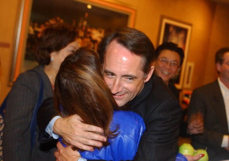 Christine Cotter –– – State Senator Joe Dunn greets supporters in the lobby outside of the Marina Ballroom at the Disneyland Hotel. Disneyland Hotel on election night 11–5–02.