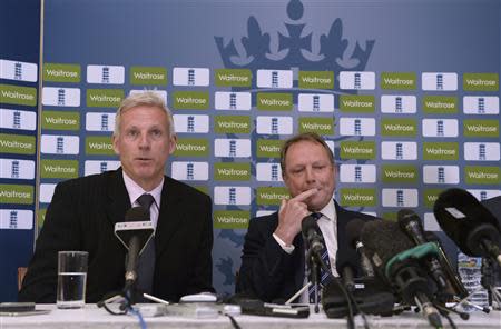 England's Peter Moores speaks as he sits with Managing Director of England Cricket Paul Downton (R) during a news conference at Lord's cricket ground in London April 19, 2014. REUTERS/Philip Brown