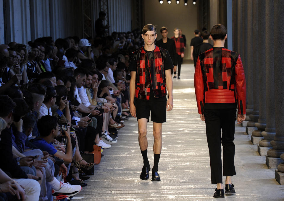 CORRECTS NAME OF FASHION DESIGNER - Models wear creations of the Neil Barrett men's Spring-Summer 2014-15 collection, part of the Milan Fashion Week, unveiled in Milan, Italy, Saturday, June 22, 2013. (AP Photo/Giuseppe Aresu)