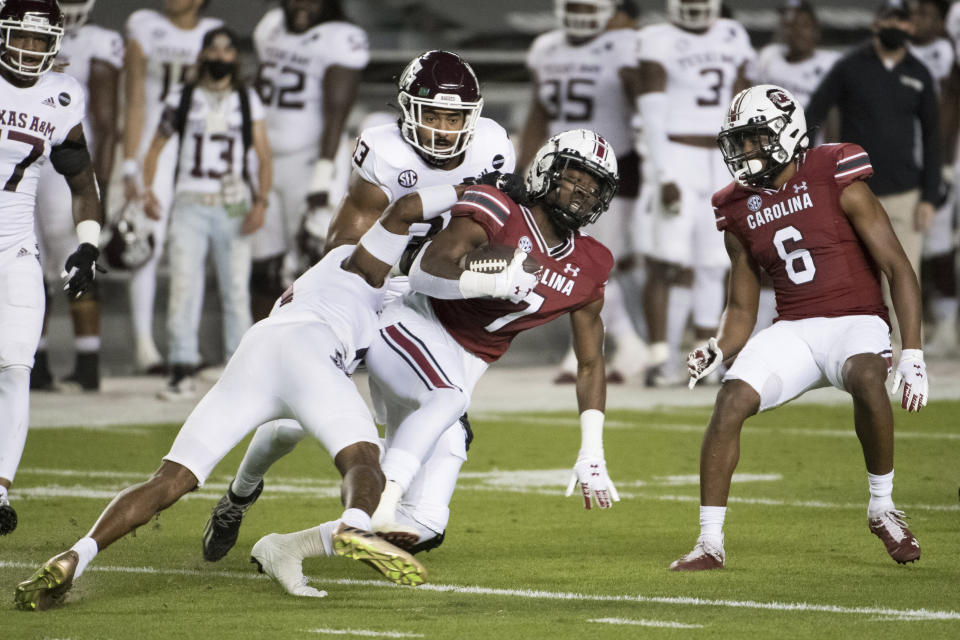 South Carolina kick returner Jammie Robinson (7) is tackled by Texas A&M defensive back Myles Jones (0) during the first half of an NCAA college football game Saturday, Nov. 7, 2020, in Columbia, S.C. (AP Photo/Sean Rayford)