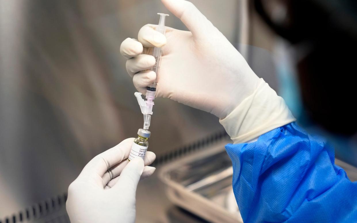 A pharmacist holds a vial of lenacapavir, the new HIV prevention injectable drug, at the Desmond Tutu Health Foundation's Masiphumelele Research Site, in Cape Town, South Africa