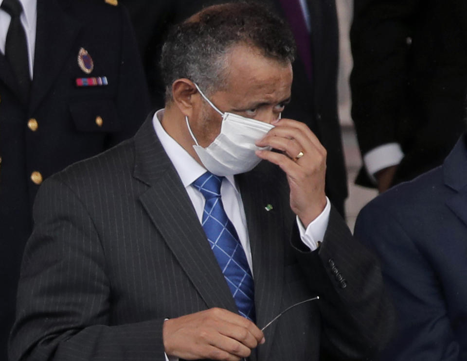 FILE - In this file photo dated Tuesday, July 14, 2020, Director General of the World Health Organization, Tedros Adhanom Ghebreyesus, adjusts his face mask during the Bastille Day military parade, in Paris. France. More than 20 heads of government and global agencies have called for an international treaty for pandemic preparedness and response, that they say will protect future generations from future pandemics, with WHO's Tedros Adhanom Ghebreyesus and other leaders calling for countries to act cooperatively. (AP Photo/Christophe Ena, FILE)