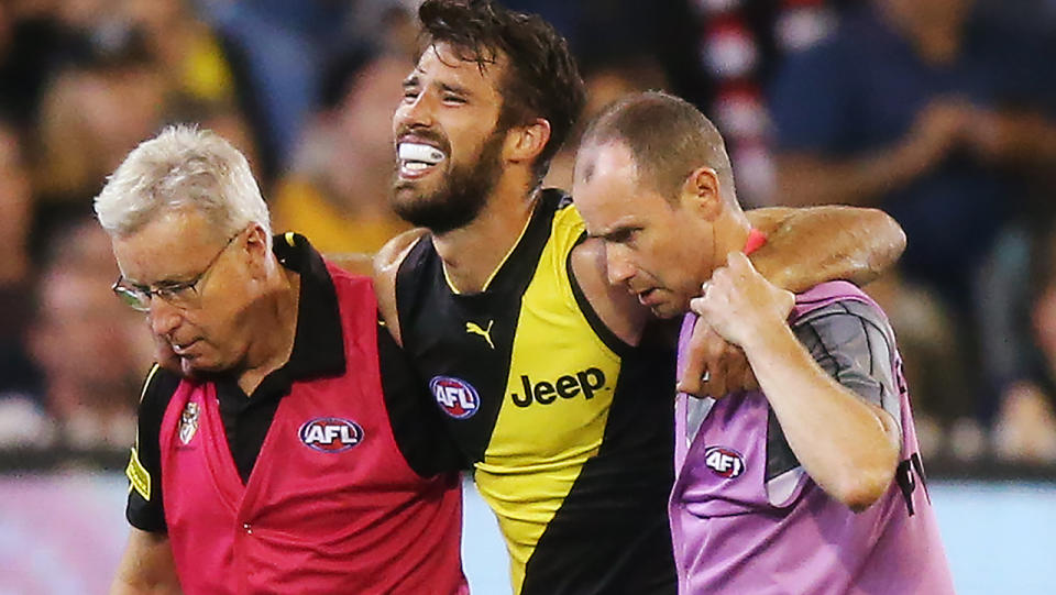 Alex Rance comes off injured. (Photo by Michael Dodge/Getty Images)