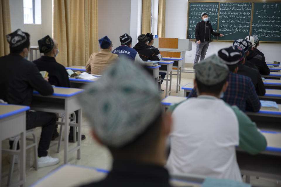 Students training to become imams recite verses from the Quran at the Xinjiang Islamic Institute in Urumqi, the capital of China's far west Xinjiang region, during a government organized visit for foreign journalists on April 21, 2021. Four years after Beijing's brutal crackdown on largely Muslim minorities native to Xinjiang, Chinese authorities are dialing back the region's high-tech police state and stepping up tourism. But even as a sense of normality returns, fear remains, hidden but pervasive. (AP Photo/Mark Schiefelbein)