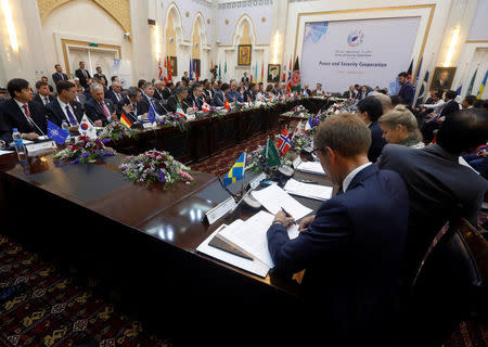 Foreign delegation members listen as Afghan President Ashraf Ghani delivers a speech during a peace and security cooperation conference in Kabul, Afghanistan June 6, 2017. REUTERS/Omar Sobhani