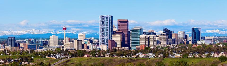 Panorama of Calgary and Rocky Mountains. Calgary, Alberta, USA. Photo ID: 258961442