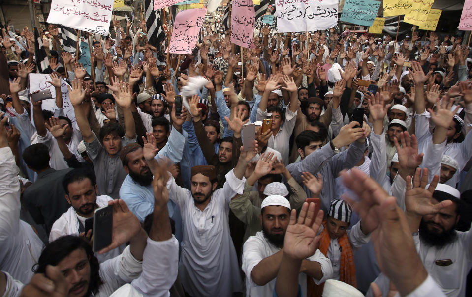 Supporters of different political parties demonstrate to reject the election results in Peshawar, Pakistan, Friday, July 27, 2018. With Pakistani election officials declaring the party of Imran Khan to be the winner of parliamentary balloting, the former cricket star turned Friday to forming a coalition government, since the party did not get an outright majority.(AP Photo/Muhammad Sajjad)