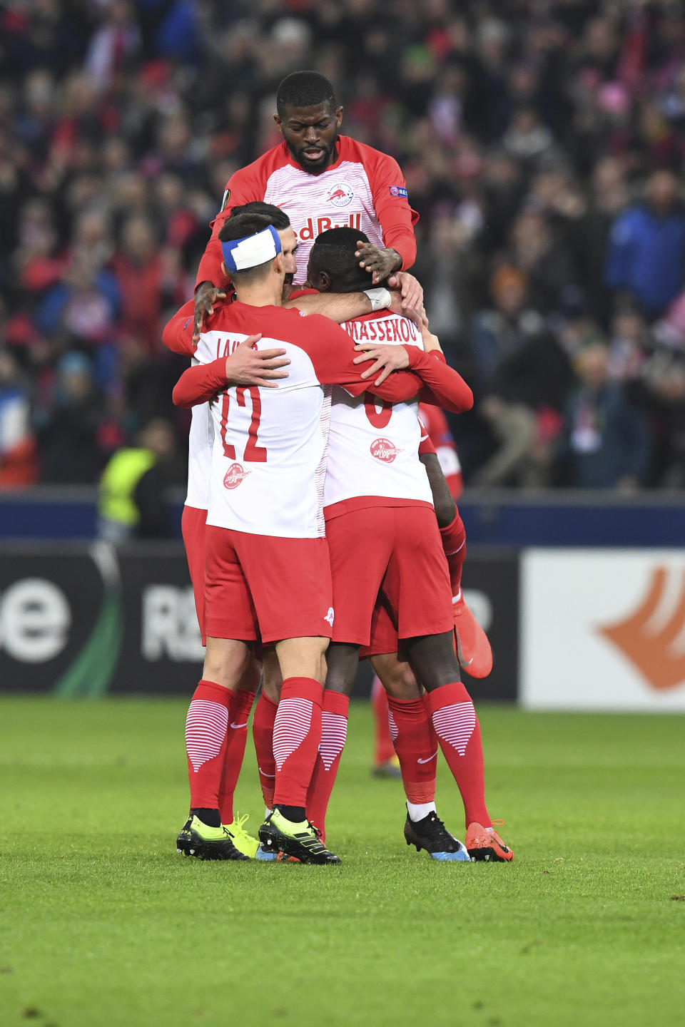 Salzburg's players celebrate after scoring during the Europa League round of 32 second leg soccer match between FC Salzburg and Club Brugge in the Arena in Salzburg, Austria, on Thursday, Feb. 21, 2019. (AP Photo/Kerstin Joensson)