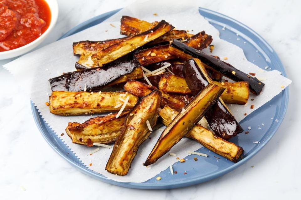 <p>If you're someone that typically enjoys aubergine in parm-form, we hear you. But when you don't feel like setting up a dredging station, the air fryer will give you a slightly crunchy outside with the much-loved creamy inside. Plus, it only needs a little bit of oil to help all of the seasoning stick. </p><p>Get the <a href="https://www.delish.com/uk/cooking/recipes/a38460663/eggplant-steak-with-chimichurri/" rel="nofollow noopener" target="_blank" data-ylk="slk:Air Fryer Aubergine;elm:context_link;itc:0;sec:content-canvas" class="link ">Air Fryer Aubergine</a> recipe.</p>