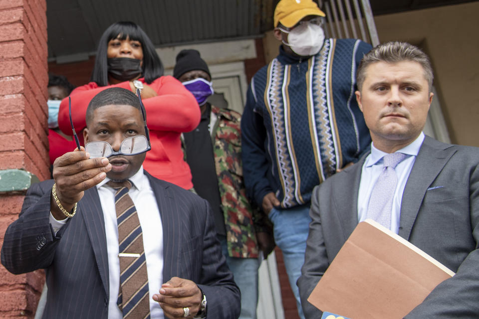 Attorney's for the Wallace family, Shaka Johnson, left, and Kevin P. O'Brien, right, speak to the media outside Walter Wallace Jr.'s home in Philadelphia, Pa., Tuesday, Oct. 27, 2020. Police officers fatally shot Wallace, a 27-year-old Black man armed with a knife during a confrontation the day before, an incident that quickly raised tensions in the neighborhood and sparked a standoff that lasted deep into the night. (Jose F. Moreno/The Philadelphia Inquirer via AP)