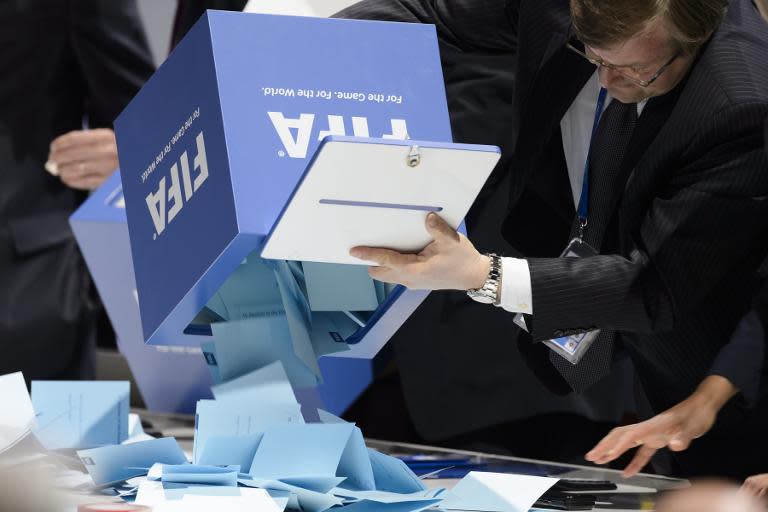 Officials open ballot boxes as vote counting gets underway following the vote to decide on the FIFA presidency in Zurich on May 29, 2015