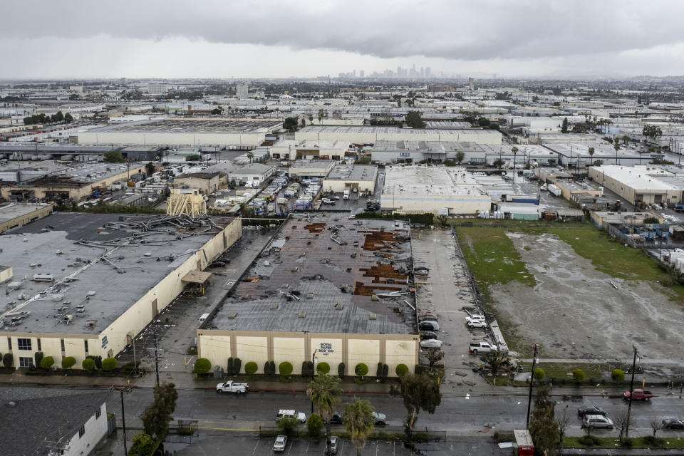 Damage to a building is seen on Wednesday, March 22, 2023 in Montebello, Calif., after a possible tornado. (AP Photo/Ringo H.W. Chiu)