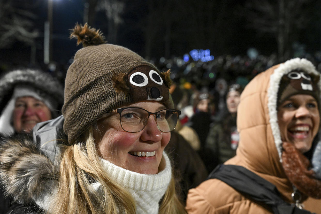 Beth Hoiseth of Sacramento, Calif. celebrates her 50th birthday waiting for Punxsutawney Phil, the weather prognosticating groundhog, to come out and make his prediction during the the 137th celebration of Groundhog Day on Gobbler's Knob in Punxsutawney, Pa., Thursday, Feb. 2, 2023. (AP Photo/Barry Reeger)