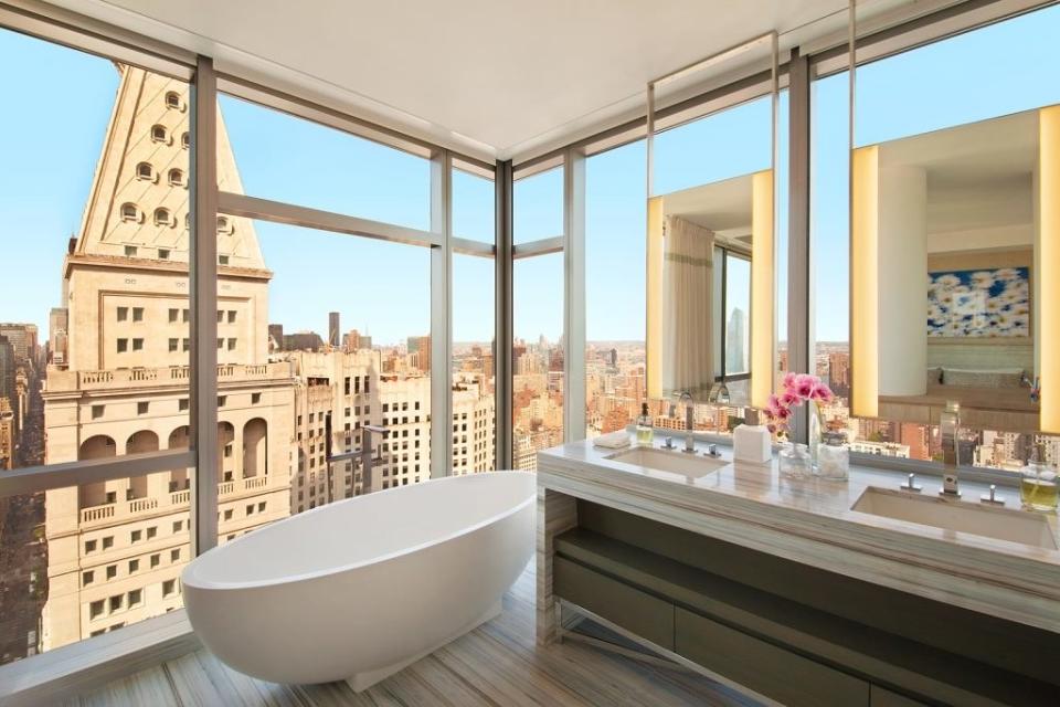 The picturesque couple originally listed the 48th-floor, 3,310-square-foot apartment for $17.25 million and have dropped the price to $13.95 million