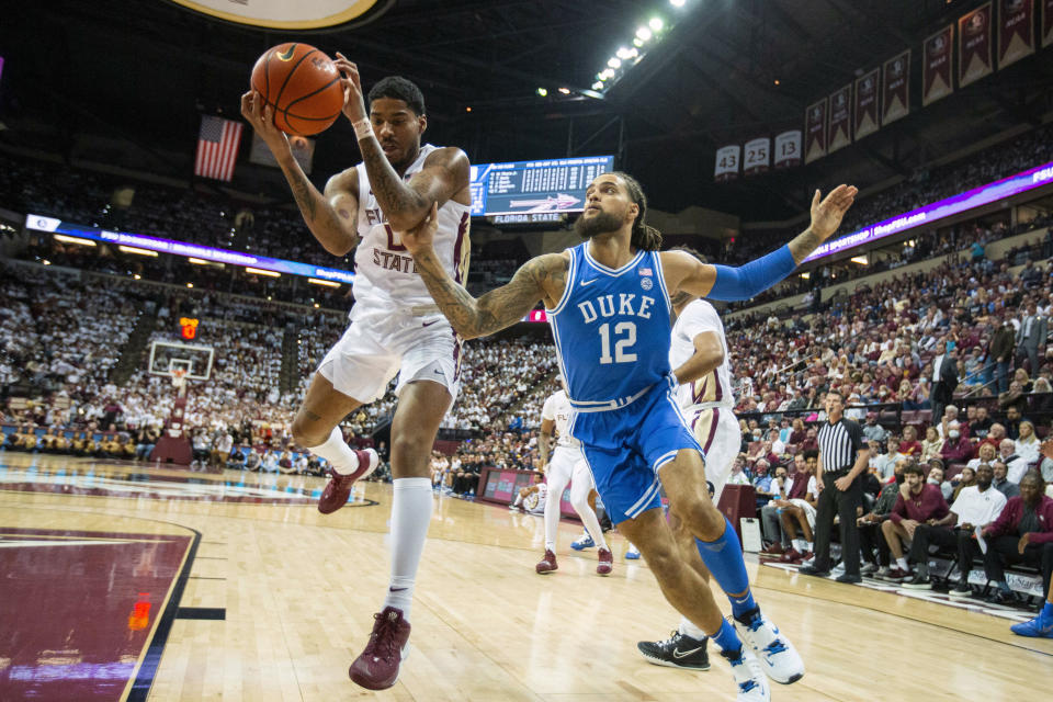 Florida State guard RayQuan Evans (0) takes the ball away from Duke forward Theo John (12) in the first half of a NCAA college basketball game in Tallahassee, Fla., Tuesday Jan. 18, 2022. (AP Photo/Mark Wallheiser)