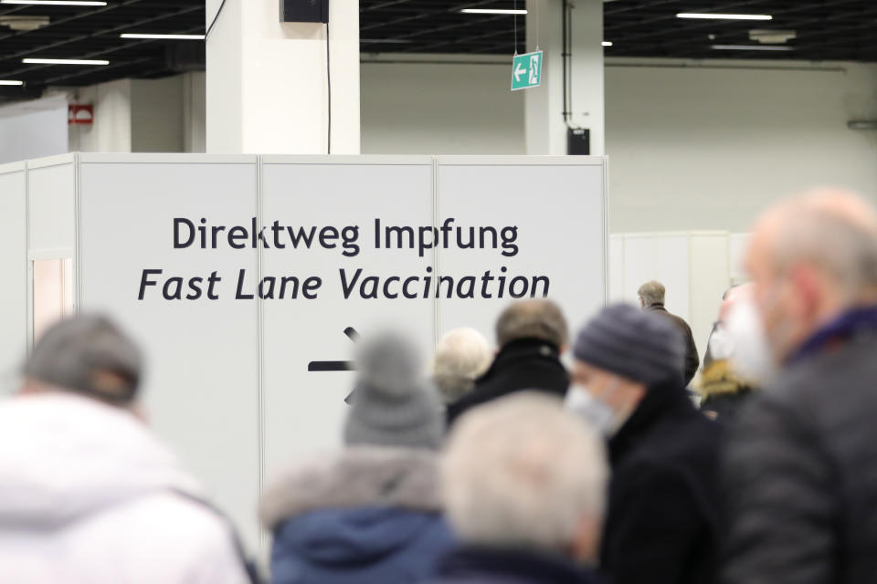 COLOGNE, GERMANY - FEBRUARY 08: Senior citizens queue up for a vaccination against COVID-19 at a vaccine center built in a hall of the Koeln Messe trade fair grounds during the second wave of the coronavirus pandemic on February 08, 2021 in Cologne, Germany. The 53 vaccine centers across North Rhine-Westphalia are opening their doors today to administer vaccines, mostly against people over 80 years old. Germany has experienced a hampered vaccine rollout due to production setbacks for all three of the vaccine so far approved in the European Union. (Photo by Andreas Rentz/Getty Images)