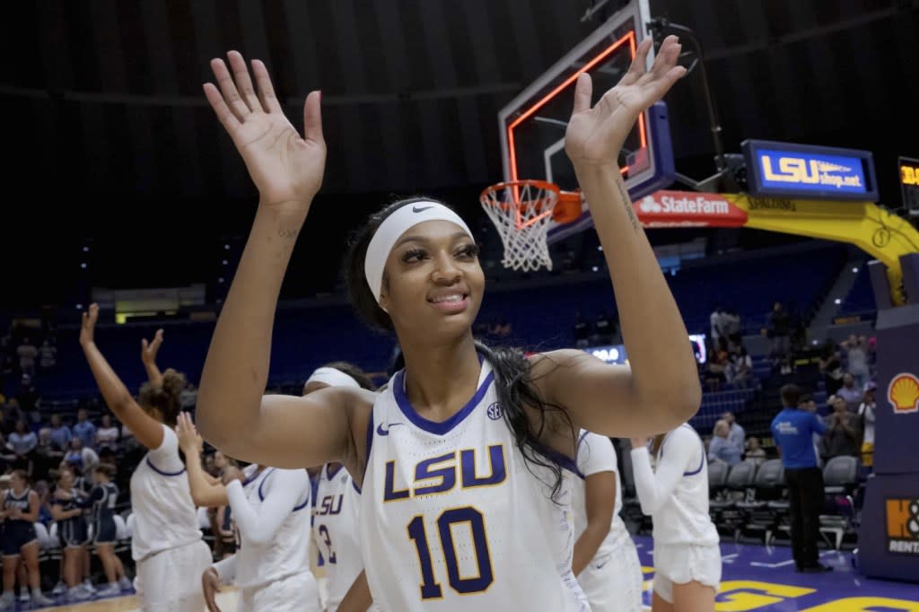 LSU forward Angel Reese (10) waves after an NCAA college basketball exhibition game against East Texas Baptist, Thursday, Oct. 26, 2023, in Baton Rouge, La. (AP Photo/Matthew Hinton)