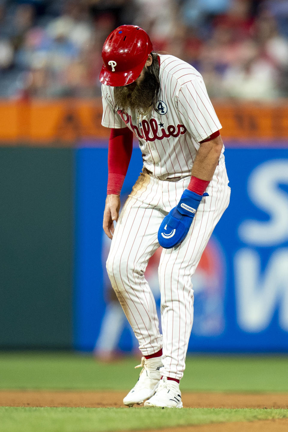 Philadelphia Phillies' Brandon Marsh grabs his leg after getting injured during the eighth inning of a baseball game against the St Louis Cardinals, Sunday, June 2, 2024, in Philadelphia. (AP Photo/Chris Szagola)