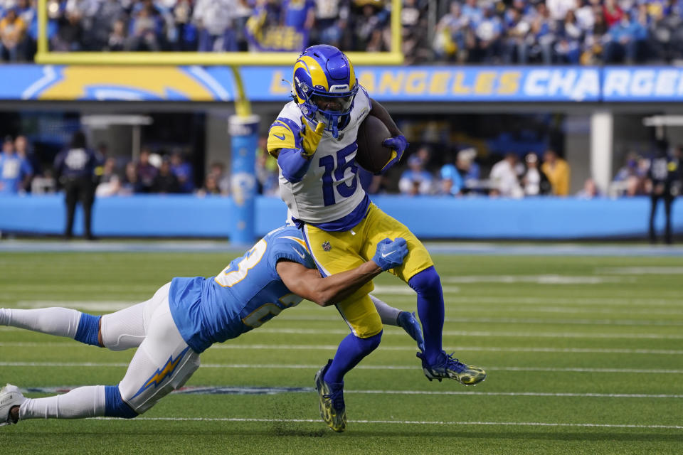 Los Angeles Rams wide receiver Tutu Atwell carries the ball during the first half of an NFL football game against the Los Angeles Chargers Sunday, Jan. 1, 2023, in Inglewood, Calif. (AP Photo/Mark J. Terrill)