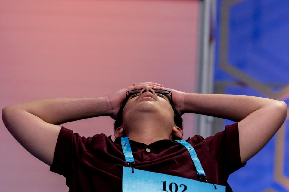 Dhroov Bharatia, 13, from Plano, Texas, reacts as he answers a question correctly during the Scripps National Spelling Bee, Wednesday, June 1, 2022, in Oxon Hill, Md. (AP Photo/Andrew Harnik)