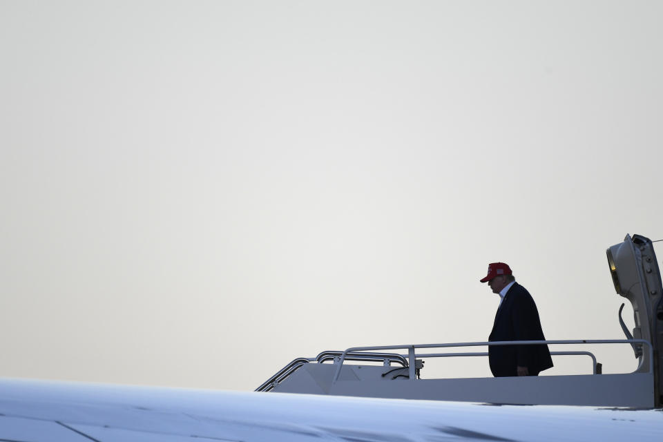 President Donald Trump walks down the steps of Air Force One at Palm Beach International Airport in West Palm Beach, Fla., Friday, Nov. 29, 2019. Trump is returning from a surprise trip to Afghanistan with troops for Thanksgiving. (AP Photo/Susan Walsh)