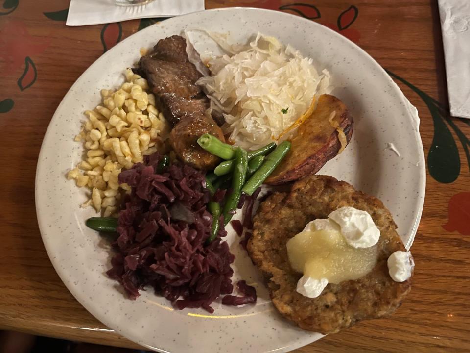 plate full of german food from biergarten in epcot disney world