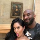 Then took their family on a Bryant vacation to Paris, France, where the couple took a silly selfie in front of the <em>Mona Lisa</em>.