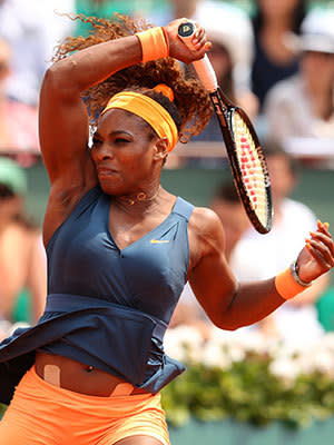 Serena Williams of United States of America plays a return in her Women's Singles Final match against Maria Sharapova of Russia during day fourteen of French Open at Roland Garros on June 8, 2013 in Paris, France.