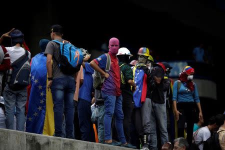 Opposition supporters rally against Venezuela's President Nicolas Maduro's government in Caracas, Venezuela August 4, 2017. REUTERS/Marco Bello