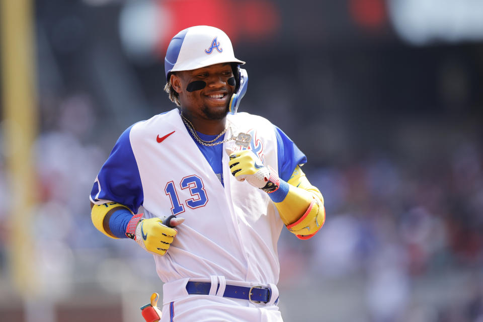 Atlanta Braves right fielder Ronald Acuna Jr. (13) reacts after hitting a home run against the Miami Marlins in the first inning during a baseball game Saturday, July 1, 2023, in Atlanta. (AP Photo/Alex Slitz)