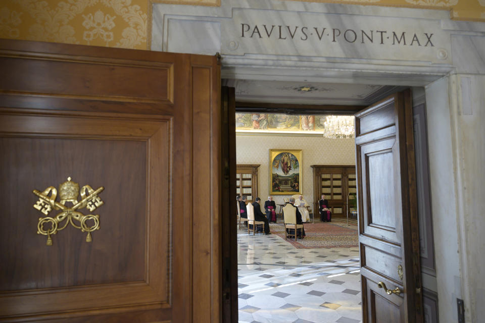 Pope Francis holds his general audience at the Vatican, Wednesday, March 11, 2020. Pope Francis held his weekly general audience in the privacy of his library as the Vatican implemented Italy’s drastic coronavirus lockdown measures, barring the general public from St. Peter’s Square and taking precautions to limit the spread of infections in the tiny city state. For most people, the new coronavirus causes only mild or moderate symptoms, such as fever and cough. For some, especially older adults and people with existing health problems, it can cause more severe illness, including pneumonia. (Vatican News via AP)