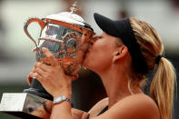 PARIS, FRANCE - JUNE 09: Maria Sharapova of Russia kisses the Coupe Suzanne Lenglen in the women's singles final against Sara Errani of Italy during day 14 of the French Open at Roland Garros on June 9, 2012 in Paris, France. (Photo by Clive Brunskill/Getty Images)