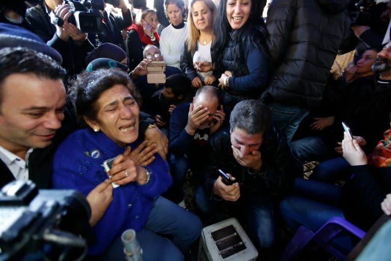 Relatives of Lebanese soldiers and policemen kidnapped by jihadist groups last year hear that their loved ones have been released, on December 1, 2015 in downtown Beirut