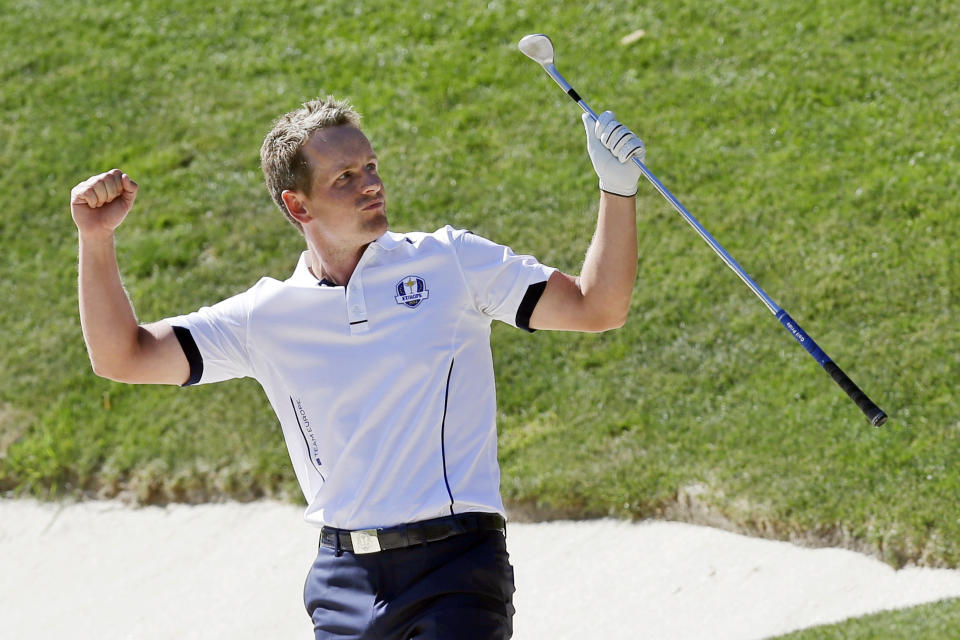 FILE - Europe's Luke Donald reacts after hitting out of a sand trap on the 17th hole during a singles match at the Ryder Cup golf matches on Sept. 30, 2012, at the Medinah Country Club in Medinah, Ill. Donald has been selected Ryder Cup captain for Europe, taking over for Henrik Stenson after the Swede was stripped of the job for signing on with the Saudi-funded LIV Golf series. (AP Photo/David J. Phillip, File)