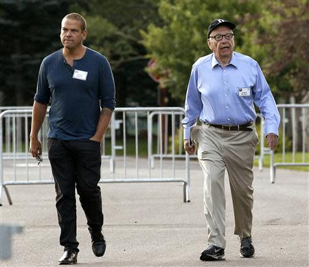 Rupert Murdoch, Executive Chairman of News Corp. CEO of 21st Century Fox, arrives with son Lachlan (L) for the first session of annual Allen and Co. conference at the Sun Valley, Idaho Resort in this July 10, 2013 file photo. REUTERS/Rick Wilking/Files