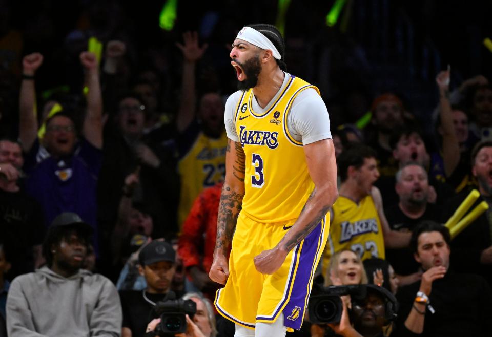 Los Angeles Lakers forward Anthony Davis celebrates after a dunk over Memphis Grizzlies forward Jaren Jackson Jr.